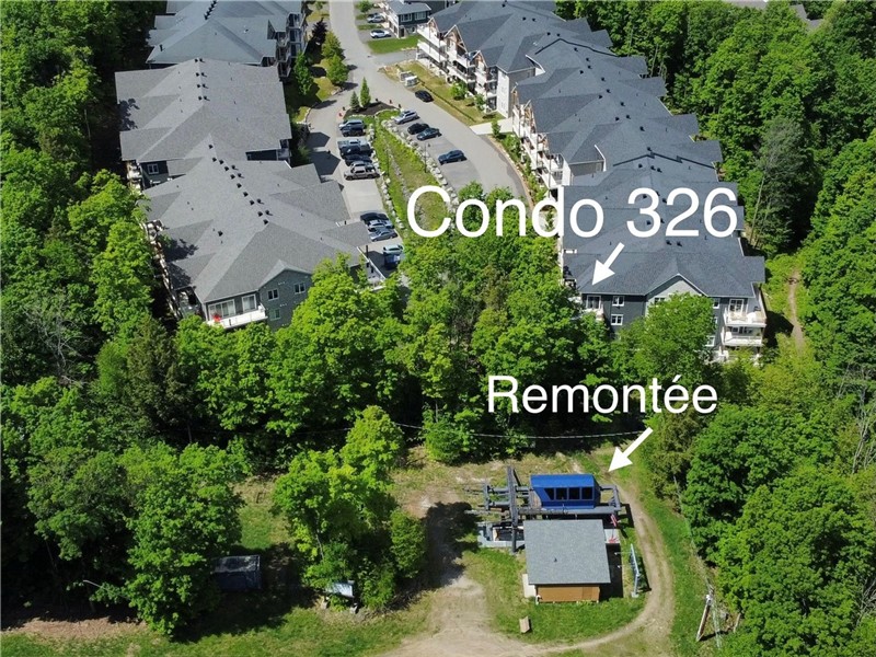Luxueux Condo de coin ski (bike) in/ski (bike) out, stationnement int., piscine ext.
