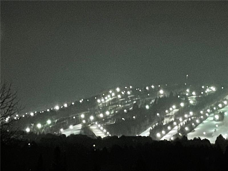 An elegant, inviting home with breathtaking views of Mont Saint-Sauveur and its illuminated ski slop