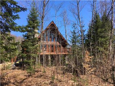 Chalet bois rond au bord du lac - Le Grizzly