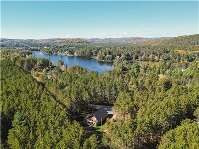 Chalet en bois rond avec plage, spa, volleyball et +