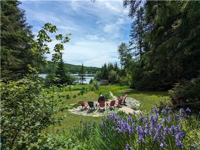 Lakefront picturesque chalet | Cozy, wood-burning fireplace, slide, fully equipped